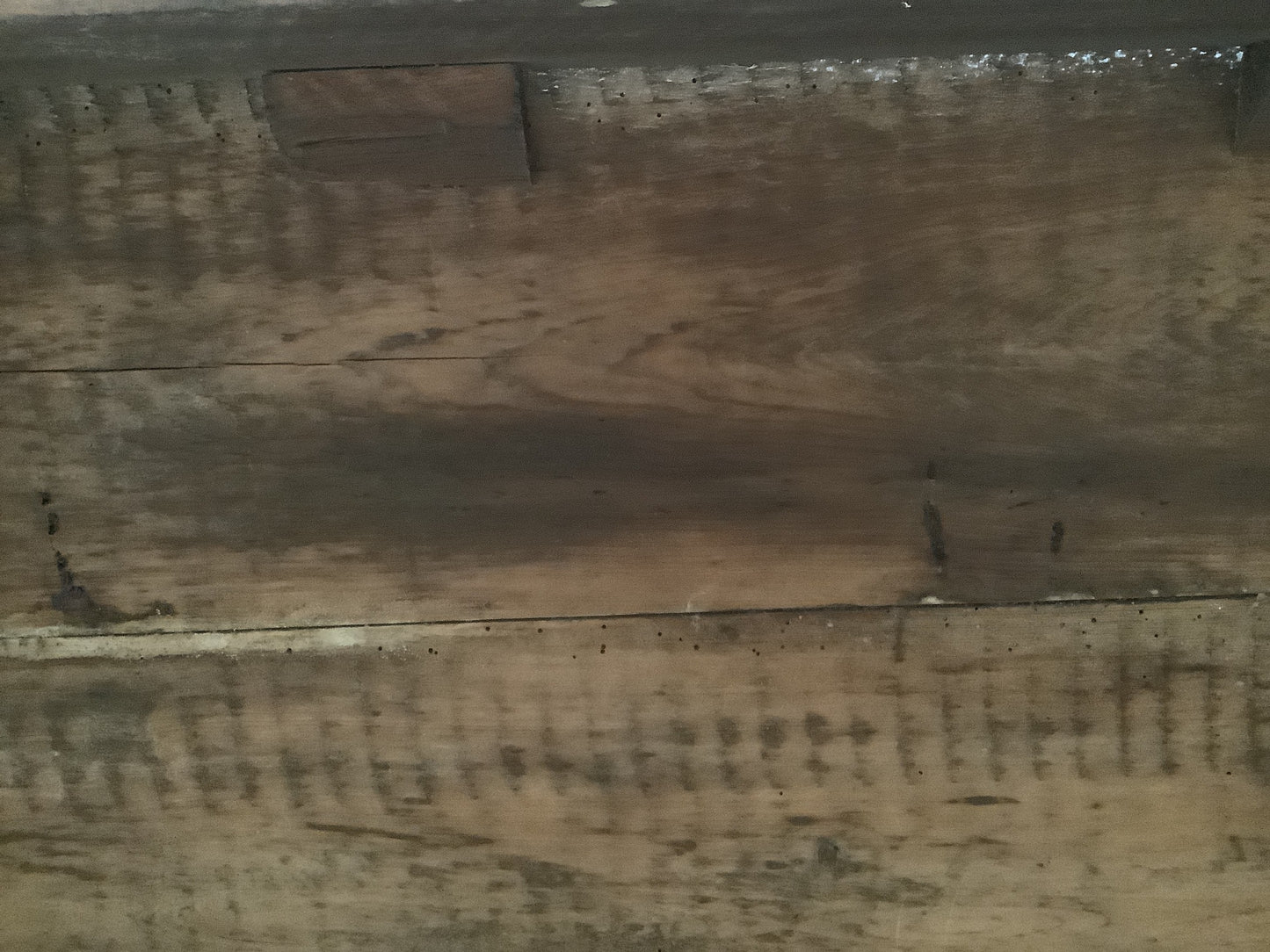 Underneath old woodworm damage