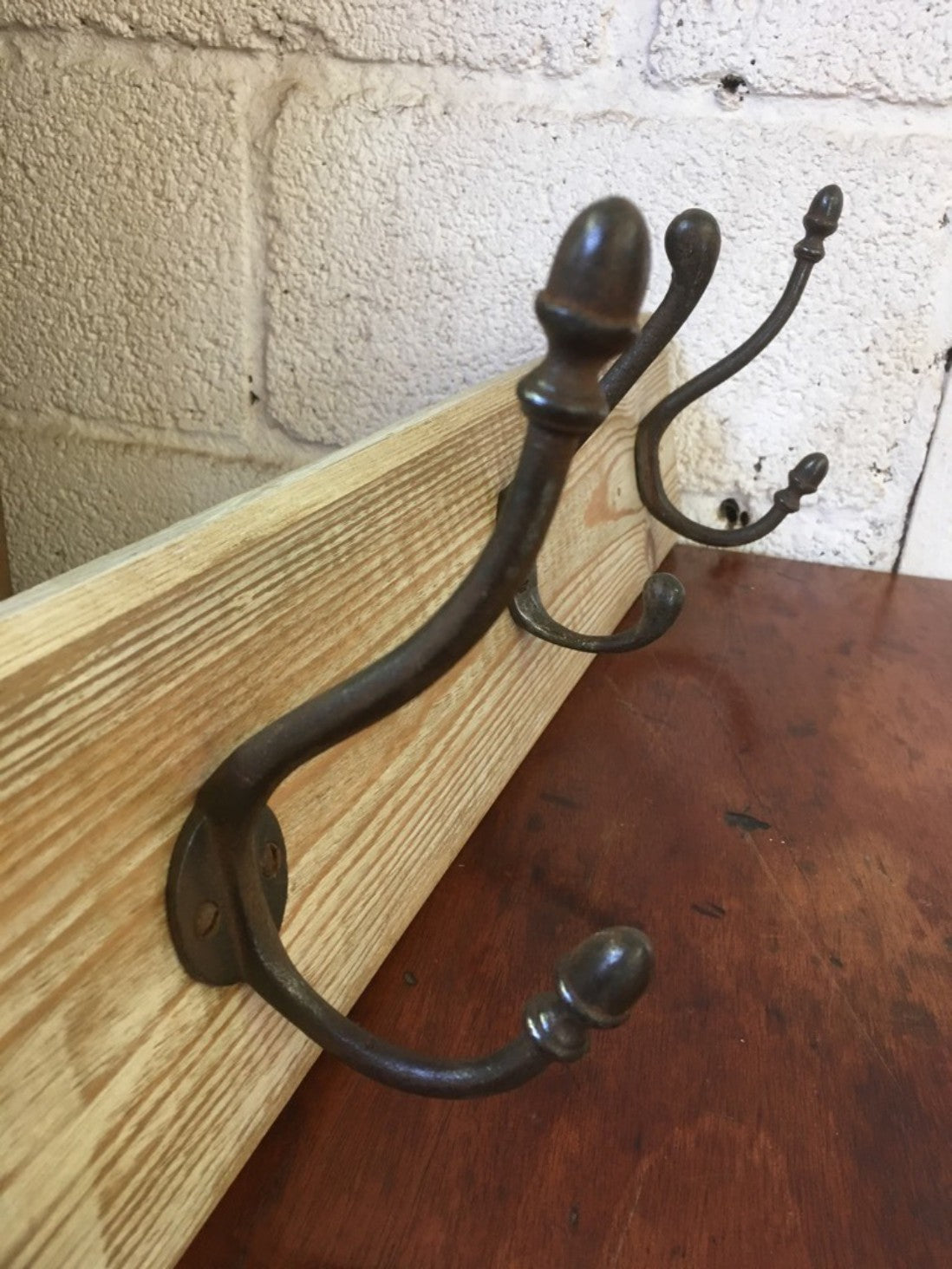 23 7/8” X 5 5/8” Lovely Old Reclaimed Pine Rack Of 3 Cast Iron Single Coat Hooks