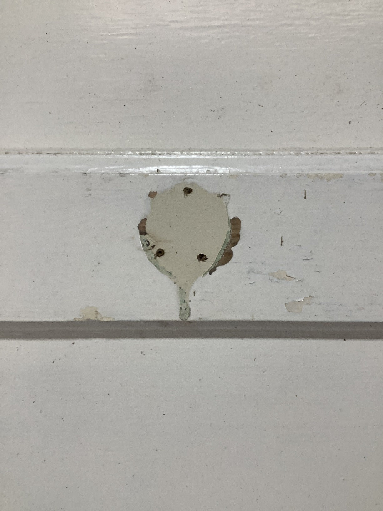 5th picture showing old hook screw holes