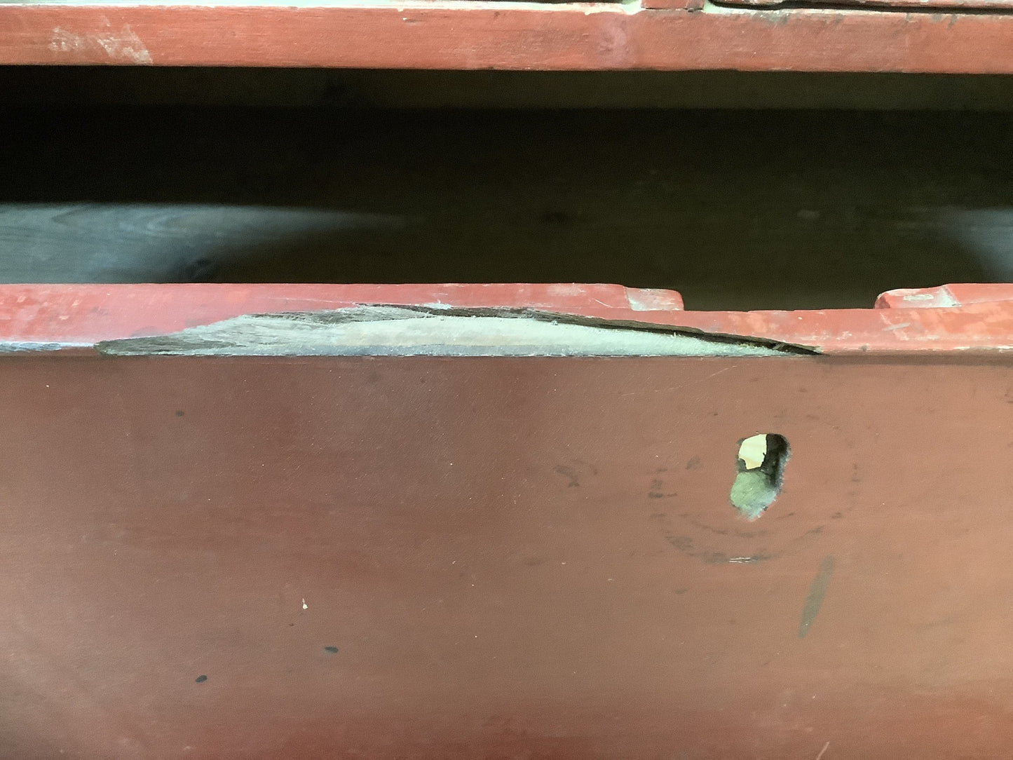 Damage to edge of first long drawers lock been removed