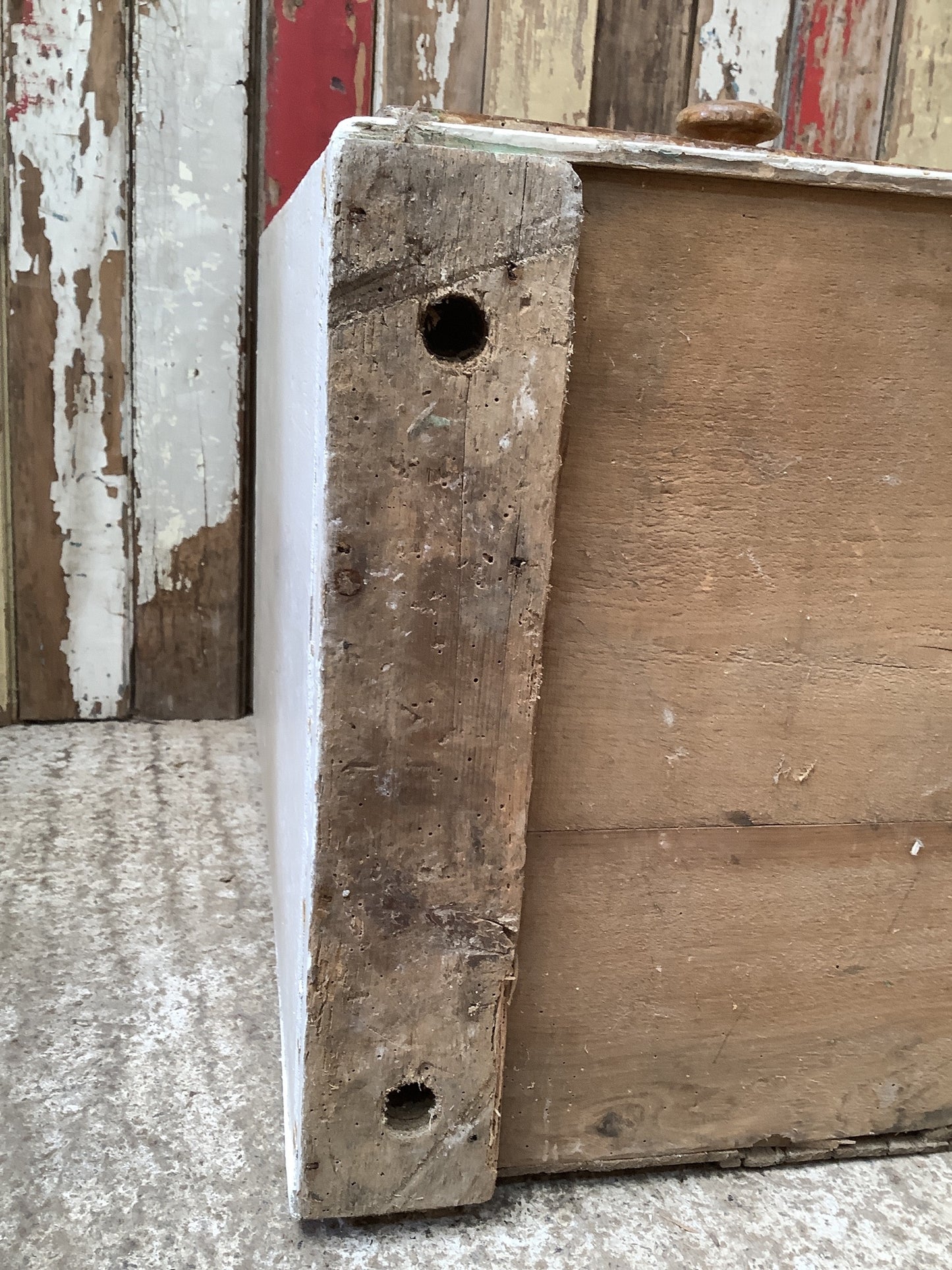 Old woodworm damage and old feet holes